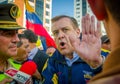 Quito, Ecuador - April 7, 2016: Closeup opposition leader Andres Paez sorrounded by people, police and journalists during anti gov