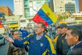 Quito, Ecuador - April 7, 2016: Closeup opposition leader Andres Paez surrounded by people, police and journalists