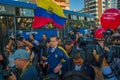 Quito, Ecuador - April 7, 2016: Closeup opposition leader Andres Paez surrounded by people, police and journalists