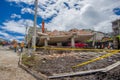 Quito, Ecuador - April,17, 2016: House destroyed by Earthquake, with a red car caught under the destroyed construction, and heavy