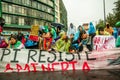 Quito, Ecuador - August 27, 2015: Group of angry mixed young people holding up banner and protesting angrily in city