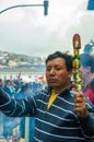 Quito, Ecuador - August 27, 2015: Man selling barbecue skewers in city streets during anti government mass Royalty Free Stock Photo