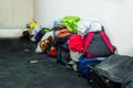 QUITO, ECUADOR, AUGUST 21, 2018: Pile of colorful clothes, bags and accessories in the ground of a room inside of a