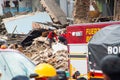 Quito, Ecuador - December 09, 2016: An unidentified firemans in a completely ruined brick building in Quito city with