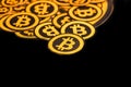 Quito, Ecuador - January 31, 2018: Indoor view of selective focus of Golden Bitcoin logo. with small bitcoins logos Royalty Free Stock Photo