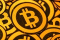 Quito, Ecuador - January 31, 2018: Indoor view of selective focus of Golden Bitcoin logo. with small bitcoins logos Royalty Free Stock Photo