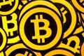 Quito, Ecuador - January 31, 2018: Indoor view of selective focus of Golden Bitcoin logo. with small bitcoins logos Royalty Free Stock Photo