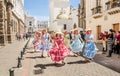 Quito, Ecuador - January 11, 2018: Outdoor view of unidentified people wearing beautiful dresses and straw hats, dancing