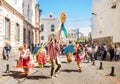 Quito, Ecuador - January 11, 2018: Outdoor view of unidentified people wearing beautiful dresses and straw hats, dancing