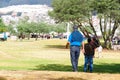 QUITO, ECUADOR - JULY 7, 2015: Men dressing with blue color walking to arrive to pope Francisco mass, at the end a lot Royalty Free Stock Photo