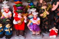 QUITO, ECUADOR- 07 MAY, 2017: Beautiful small figures of andean people made of clay over a white table Royalty Free Stock Photo