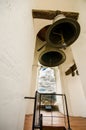 QUITO, ECUADOR - MAY 06 2016: Close up of three huge bells inside of a bulding in the San Francis church, with a town