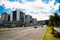 QUITO, ECUADOR - MAY 06 2016: Unidentified people waling in the mainstreet in NNUU avenue with some buildings, cars and