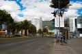 QUITO, ECUADOR - MAY 06 2016: Unidentified people waling in the mainstreet in NNUU avenue with some buildings, cars and