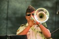 Quito, Ecuador - November 28, 2017: Close up of an unidentified man musician performing in a scaffold using his trumpet