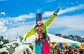 QUITO, ECUADOR- NOVEMBER, 28, 2017: Close up of unidentified person wearing a clown costume surrounding of group of