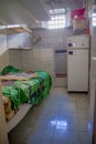 QUITO, ECUADOR - NOVEMBER 23, 2016: Indoor view of old deserted rugged building, room of the prisioners, in the old Royalty Free Stock Photo