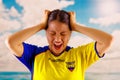 QUITO, ECUADOR -8 OCTOBER, 2016: Young ecuadorian woman wearing official Marathon football shirt standing facing camera