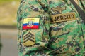 Quito, Ecuador - September, 03, 2018: Close up of selective focus of man wearing military uniform during the diablada