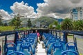 QUITO, ECUADOR - SEPTEMBER 10, 2017: Unidentifed people enjoying the beautiful view from touristic bus around different