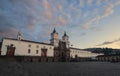 People walking in front of Church and Monastery of San Francisco at dawn. It is a 16th-century Roman Catholic complex.