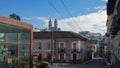 People walking on Flores street in the historic center of Quito on a sunny day Royalty Free Stock Photo