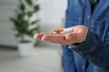 Quitting smoking concept. Woman holding broken cigarette on blurred background, closeup. Space for text Royalty Free Stock Photo