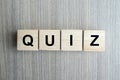 QUIZ text wood cube on wooden table background