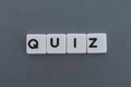 Quiz word made of square letter word on grey background