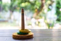 Quoits, wooden toy on wooden texture in bokeh garden background, Selective focus, Close up shot, Game and Recreation for children