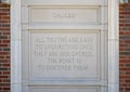 Quote portion of a relief with a Galileo bust and quote on the outside wall of a building at Texas Woman`s University.