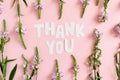 Quote Thank You made of letters cut out of paper. Pattern made of wild flowers Royalty Free Stock Photo