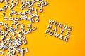 Quote WORDS HAVE POWER made out of wooden letters on bright yellow background