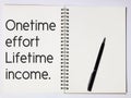 Quote written on note book. One time effort lifetime income.