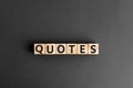 Quotes - word from wooden blocks with letters