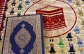 Qur'an and Muslim prayer carpet