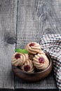 Qurabiya cookie shortbread with jam on rustic wooden table Royalty Free Stock Photo