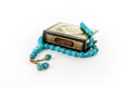 Quran with Blue Rosary - holy book of Muslims - Koran - quran white background Royalty Free Stock Photo