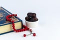 Quran book, dried dates fruit and red rosary beads isolated on white background. Royalty Free Stock Photo