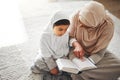 Quran, Islamic and mother and child prayer to Allah, god or holy spirit for Arabic religion, faith and learning to pray Royalty Free Stock Photo