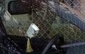 Quran or Koran, the holy book of Islam, in a tiny size, attached on a rear mirror of a car.