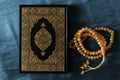 The Quran pak- holy books of Muslims and beads Ramadan kareem/Eid al fitr Concept.