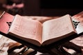 Quran on a rihal or wooden book stand at home