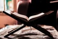 Quran on a rihal or wooden book stand at home