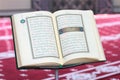 Quran, on a wooden stand in mosque. Royalty Free Stock Photo