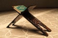 Quran on a wooden stand in mosque. Royalty Free Stock Photo