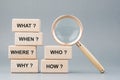 Qurstion words on stack of wood blocks