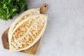 Qutab with green on gray background. Azerbaijani flat bread with green. Top view, copy space. Azerbaijani, armenian food