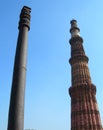 The Qutub Minar minaret and the iron pillar in New Delhi, India. Royalty Free Stock Photo