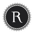 R letter in circle frame in floral ornament style on black color and white background